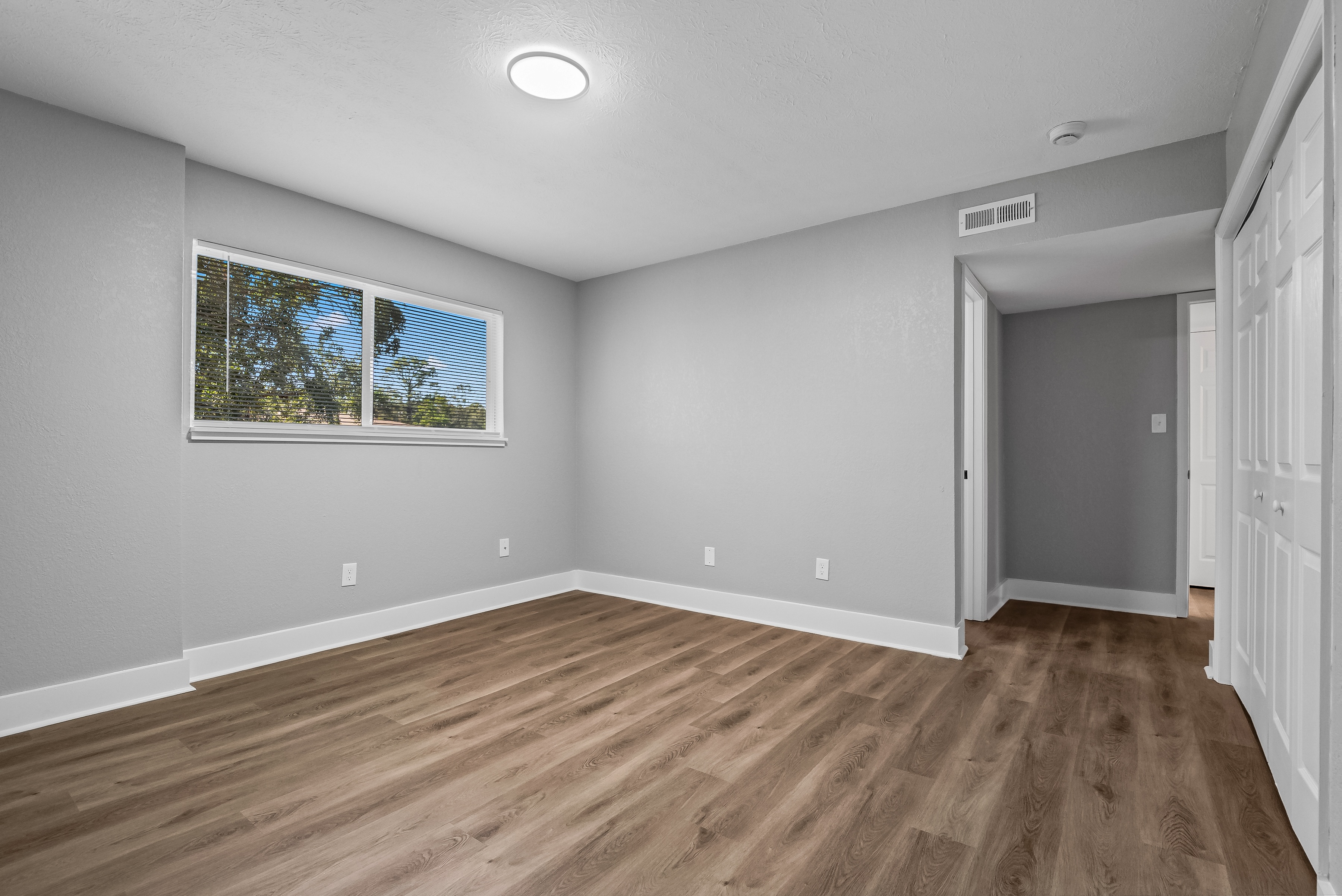 Contemporary Finishes Include Wood And Tile Flooring at Serenity Place Central, Tallahassee, Florida